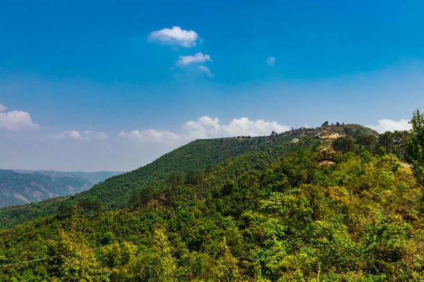 istock mountain covered with green forests and bright blue sky at morning from flat angle 1395702533