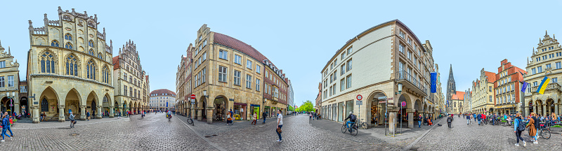Muenster, Germany - April 29, 2022: scenic view to facade of old historic houses in panoramic view at the Prinzipal markt engl: square of the prince in Muenster.