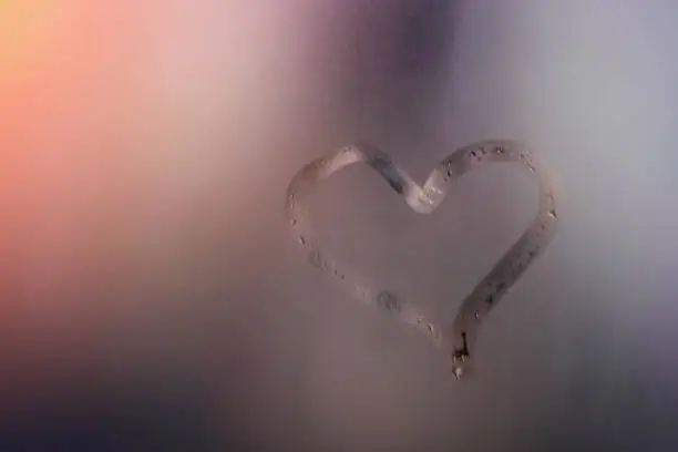 Photo of Heart on wet mirror. Concept love.