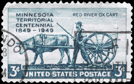 A Stamp printed in USA shows the Pioneer and Red River Oxcart, Minnesota Territory Issue, circa 1949