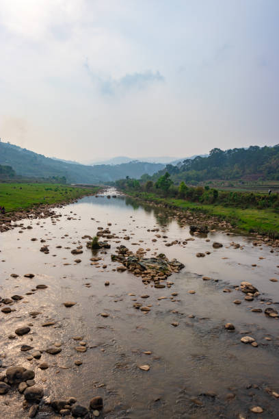 istock river leading to the misty mountain with cloudy sky at morning from flat angle 1395707312