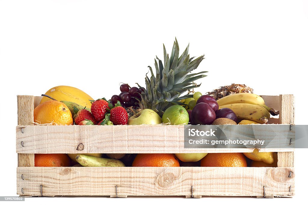Fruit in wooden box Various types of fruit stored in wooden box on white background Fruit Stock Photo