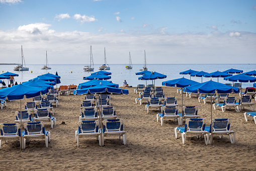 Empty beach chairs at Playa de las Americas which is a popular tourist location on the south coast of the the Spanish Canary Island Tenerife.