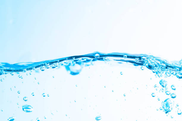 istock Background image of moving water in waves,bubbles, on white background 1395711278