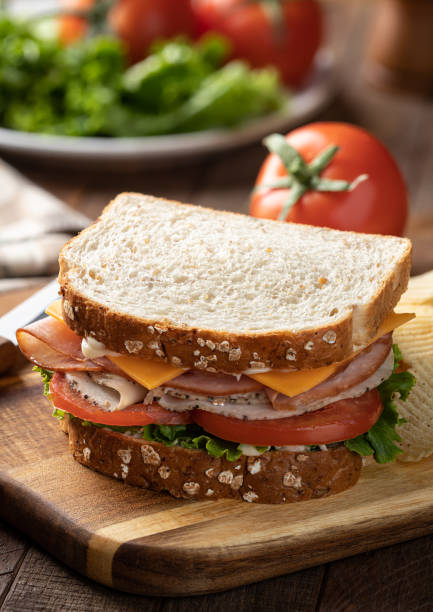 istock Turkey and ham sandwich on whole grain bread 1395711282