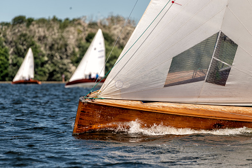 classic sailing yacht sailing on a lake during a regatta
