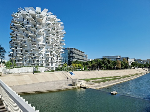L'Arbre Blanc - White Tree is a unique residential bilding in Montpellier. The building was planned by: Sou Fujimoto, Nico­-las Laisné and OXO architects. The construction was finished in 2019 and contain 112 appartements on 17 storeys. the image was captured during spring season.