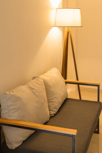 istock The included lamp, located behind the sofa with two pillows. 1395717572
