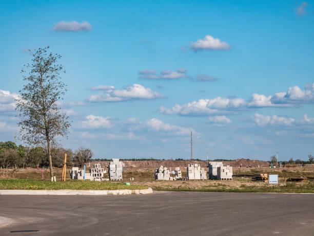 istock Concrete blocks on suburban site of impending house construction 1395717878