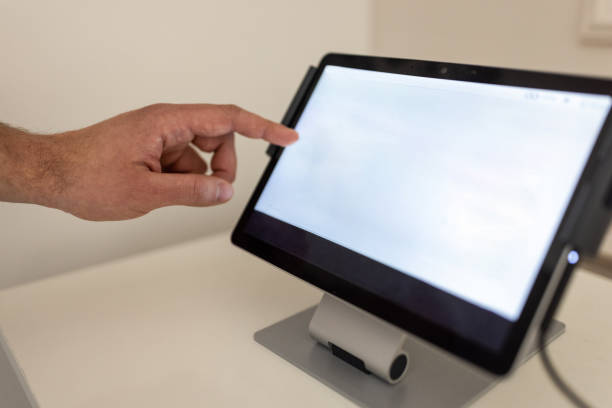 istock Unrecognizable fitness trainer controlling EMS suit on digital tablet 1395727101