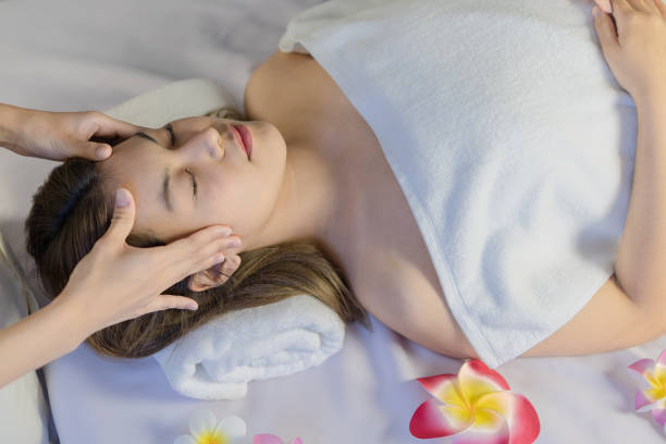 istock woman having  relaxing head spa massage 1395727559