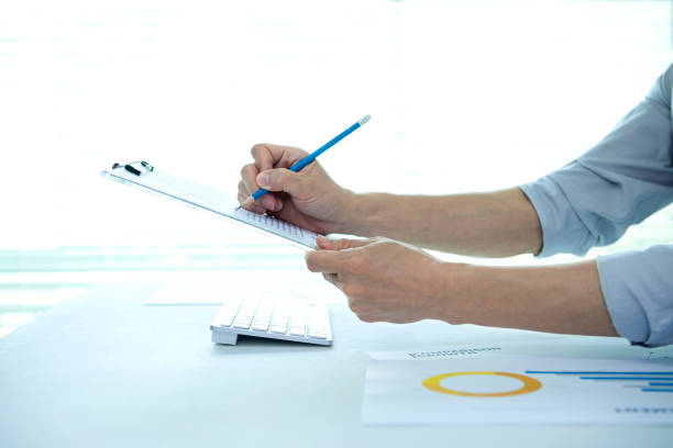 istock a businessman working hard in the office 1395728002