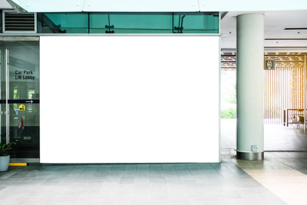 istock Billboard mock up inside the building. Template of an interior empty information billboard, Mock-up of a city banner placeholder and poster. 1395728910