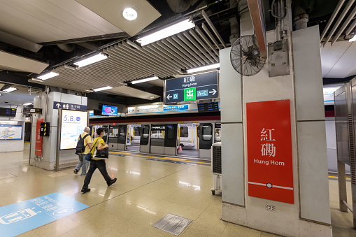 Hong Kong - May 4, 2022 : Passengers at the MTR East Rail Line Hung Hom Station in Kowloon, Hong Kong. The cross-harbour extension of the East Rail Line will begin operations on May 15.