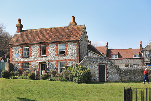East Dean, Eastbourne, England - March 24, 2022: The house at East Dean where Sir Arthur Conan Doyle's fictional detective 'Sherlock Holmes' spent his retirement; on the South Downs, near Eastbourne.