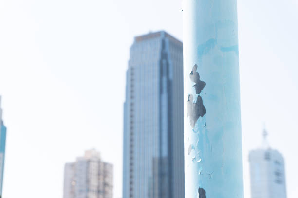 city ​​View. Selective focus on utility poles with blurry high-rise office building background in the distance. City skyline.Cityscape.Urban landscape，view.Modern architectural background.
