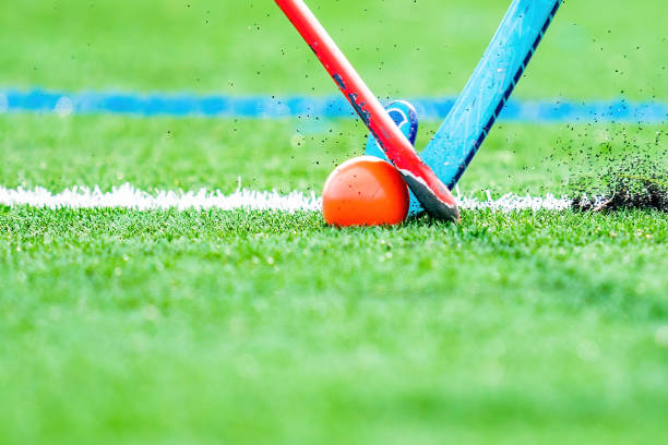 Field hockey sticks fighting for ball Field hockey sticks fighting for ball field hockey stock pictures, royalty-free photos & images