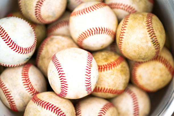istock Bucket of practice baseballs 1395736307