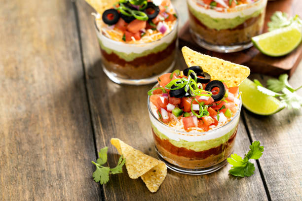 istock Seven layer dip in individual cups, mexican appetizer 1395736513