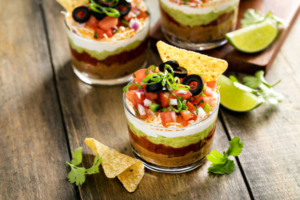 istock Seven layer dip in individual cups, mexican appetizer 1395736535