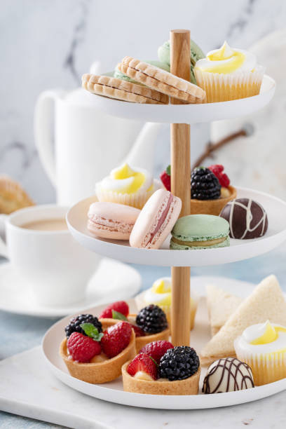 istock Spring or summer dessert table, three tiered tray with desserts 1395736552