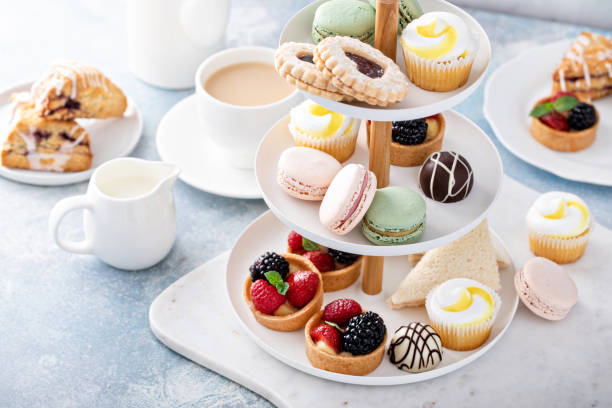 istock Spring or summer dessert table, three tiered tray with desserts 1395736553