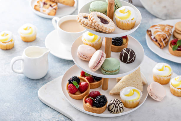 istock Spring or summer dessert table, three tiered tray with desserts 1395736561