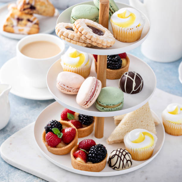 istock Spring or summer dessert table, three tiered tray with desserts 1395736660