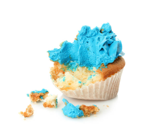 istock Failed cupcake with cream on white background. Troubles happen 1395741720
