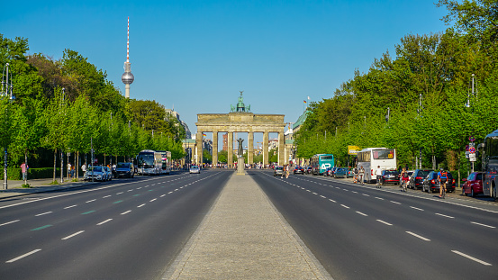 Berlin, Germany-April 2018: Brandenburg Gate, one of the city monuments and famous landmarks famous in the world, is a symbol of German division during the Cold War, and historical architectural artistic structures.