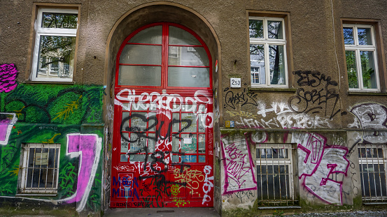Berlin, Germany-April 2018: Street art scenery in Berlin showing colourful artistic graffiti, tags and paintings on the building walls.