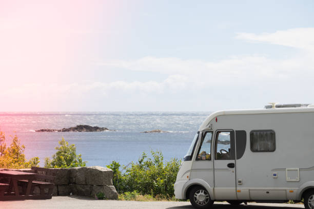 istock Camper car on coast of Norway with ocean view 1395744964