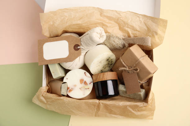istock Box with eco friendly personal care products on color background, top view 1395745699
