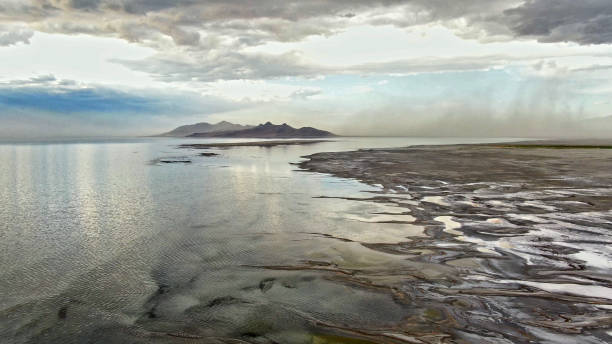 The Great Salt Lake During a Drought Hitting its Lowest Water Level in Recorded History The Great Salt Lake, depleted by drought, hits its lowest water level in recorded history bonneville salt flats stock pictures, royalty-free photos & images