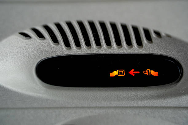 istock fasten seat belt while seated airplane sign 1395746995