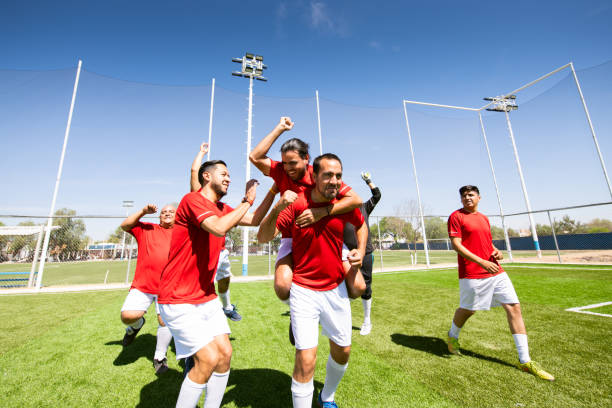 istock Soccer team celebrating victory 1395747016