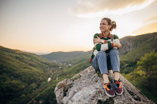istock Woman relaxing mountain top 1395747031