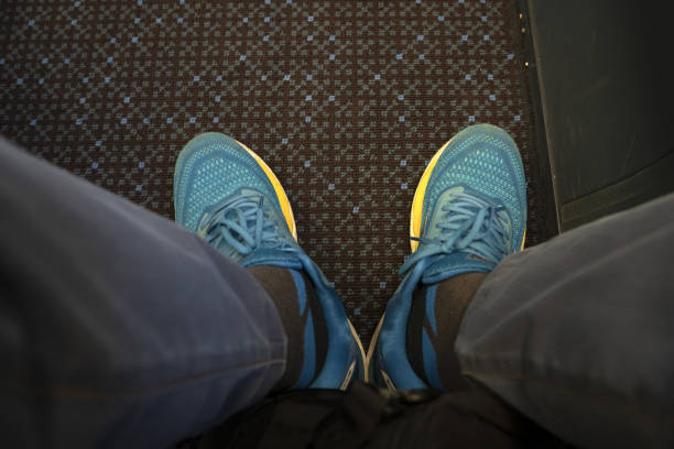 istock airplane seat space for legs 1395747037