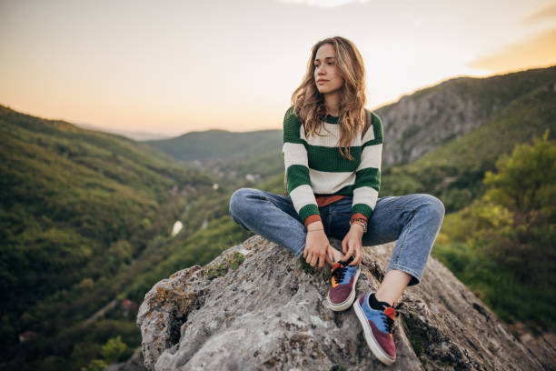 istock Woman relaxing mountain top 1395747042