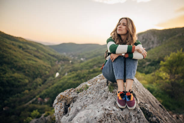 istock Woman relaxing mountain top 1395747050