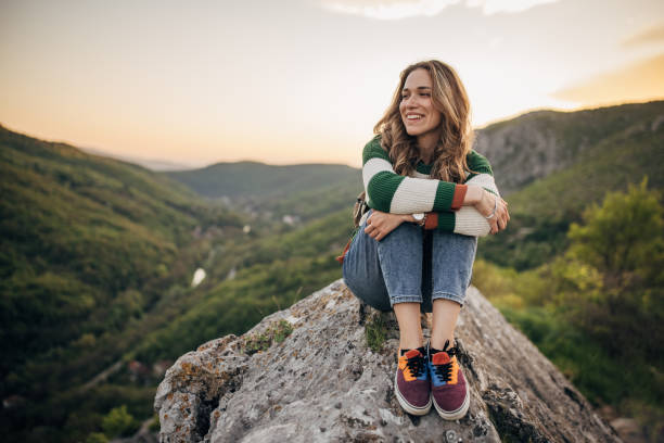 istock Woman relaxing mountain top 1395747063