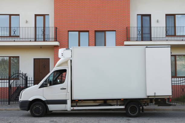 istock White van near new house. Moving service 1395748159