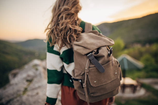 Backpack and hat at the train station . Travel concept.
