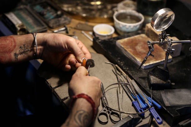 istock Jeweller polishing a ring 1395748411