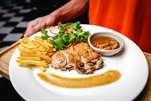 Juicy Seared Baked Chicken Breast Fine Dining Plate with Salad, French Fries, Mushroom Sauce