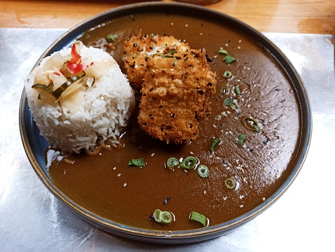 Japanese tofu katsu curry dish with steamed rice at glasgow Scotland england uk