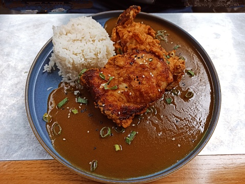 Japanese chicken katsu curry dish with steamed rice at glasgow Scotland england uk