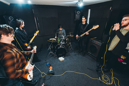 Band rehearsal in a studio.