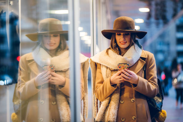 istock Woman using phone on street 1395752477