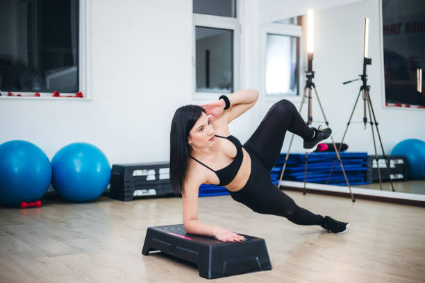 istock Young woman training in a gym 1395753363